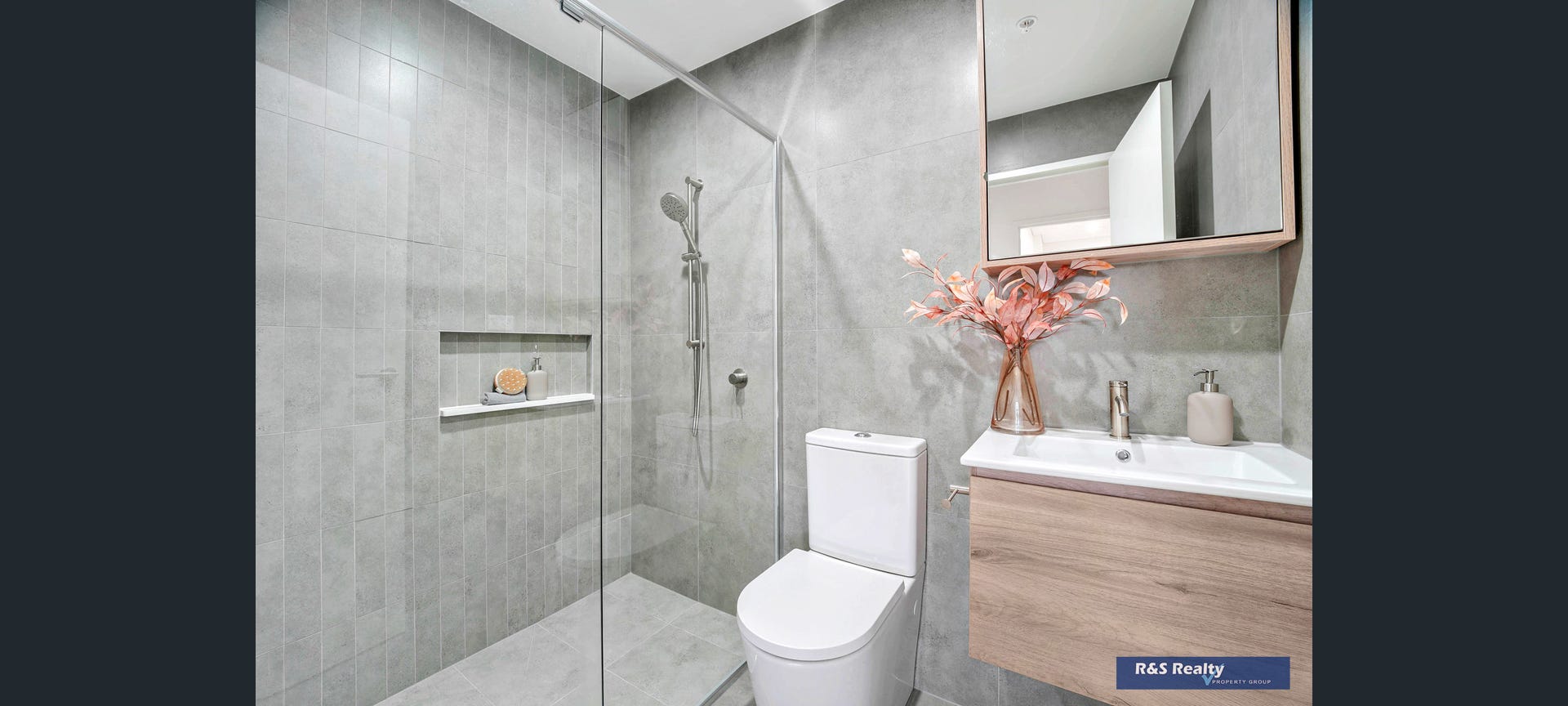 Ensuite with built-in shower recess and timber vanity