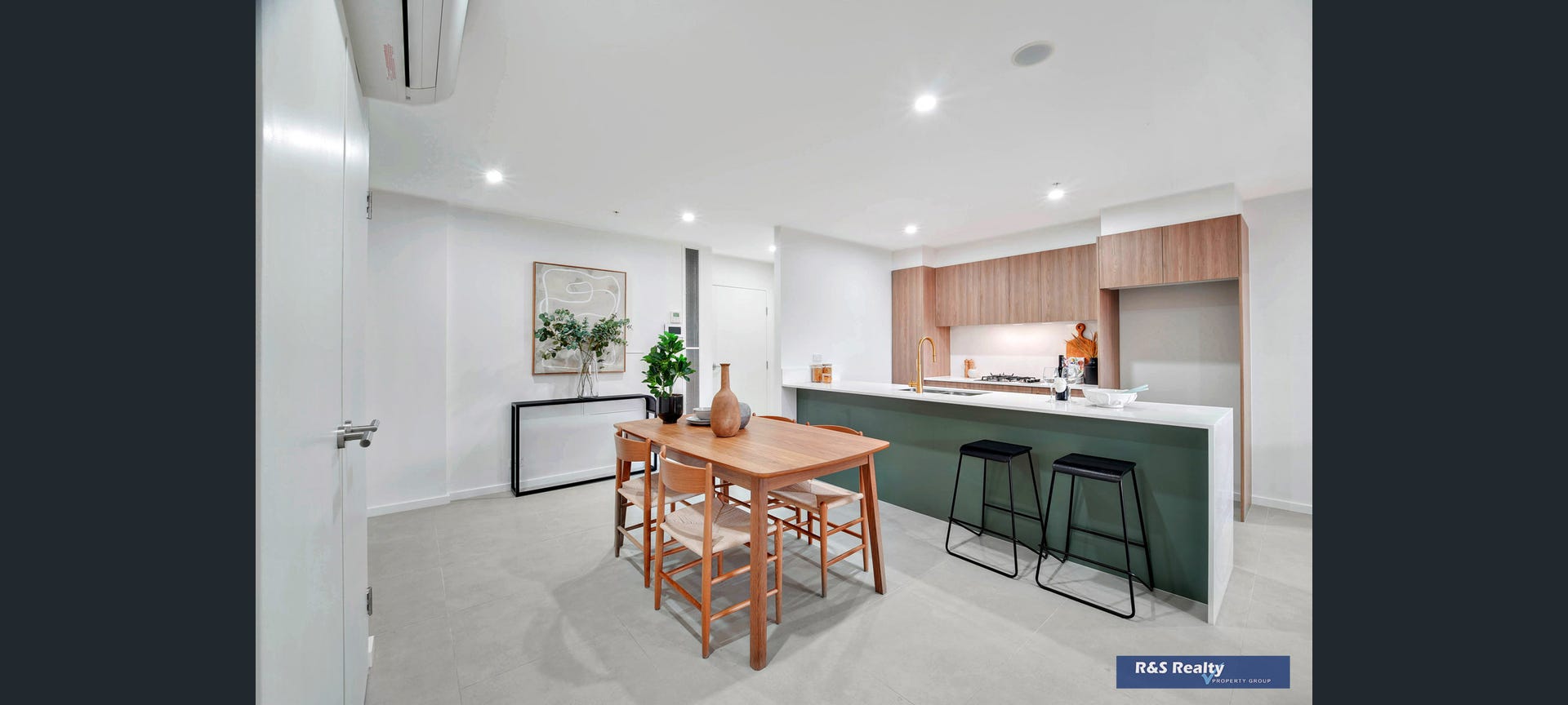 Open plan dining and kitchen with green island